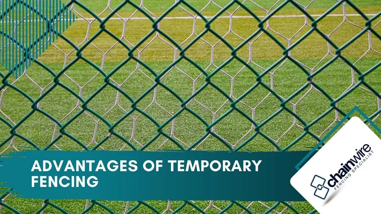 Temporary mesh fencing panels lined up along a sporting field boundary