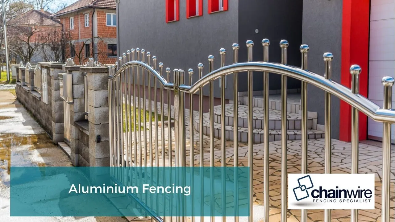 Aluminium fencing panels along a garden boundary