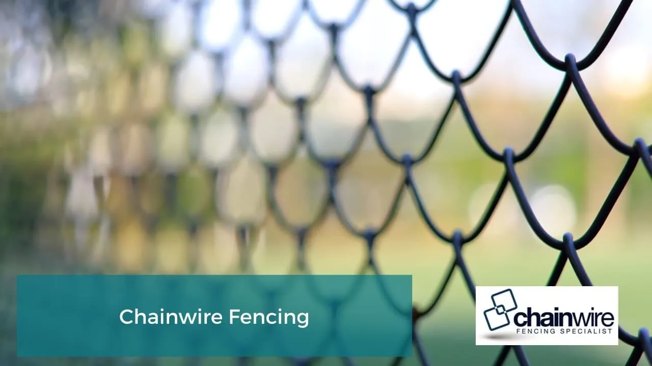 Galvanised chainwire fencing along a property boundary