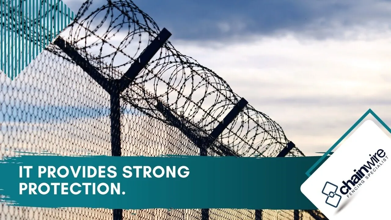 Strands of barbed wire along the top of a security fence