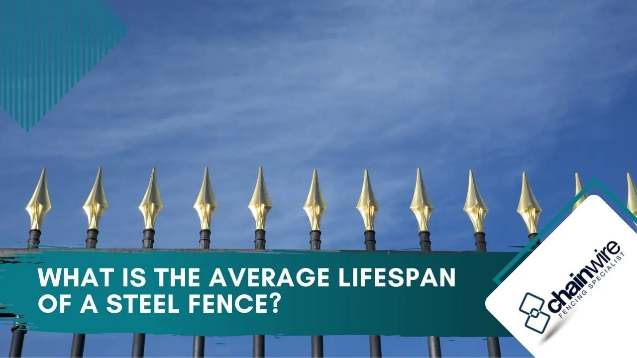 Galvanised steel security fence with vertical pales along a commercial boundary