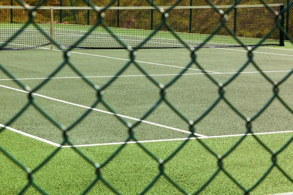 Chainwire enclosure fencing around a sports court
