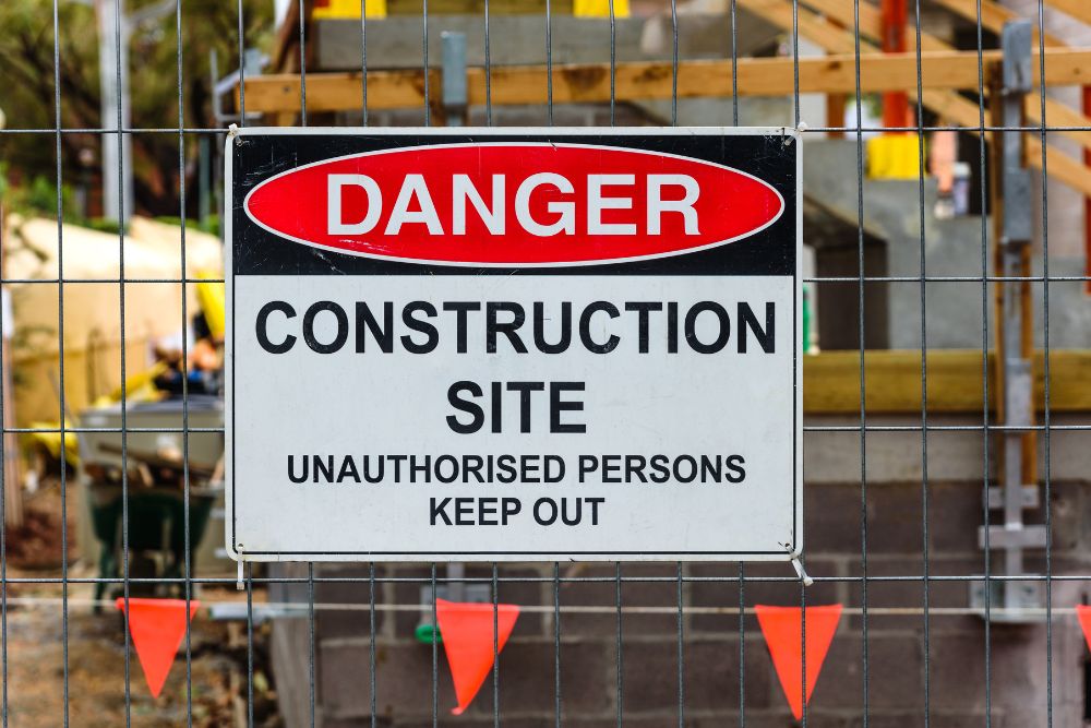 Danger construction site sign attached to temporary fence by Chainwire Fencing Specialist