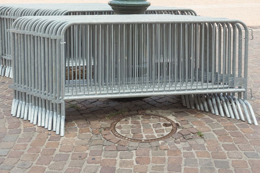 Stacked crowd control barriers at event site by Chainwire Fencing Specialist